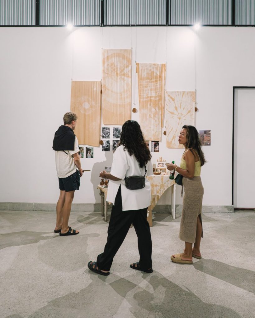 Visitors exploring contemporary Balinese art exhibition at JIMBAFEST showcasing cultural and environmental themes