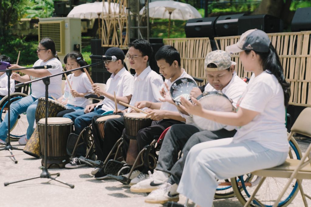 Diverse community gathering at JIMBAFEST Bali celebrating art, culture, and creativity together