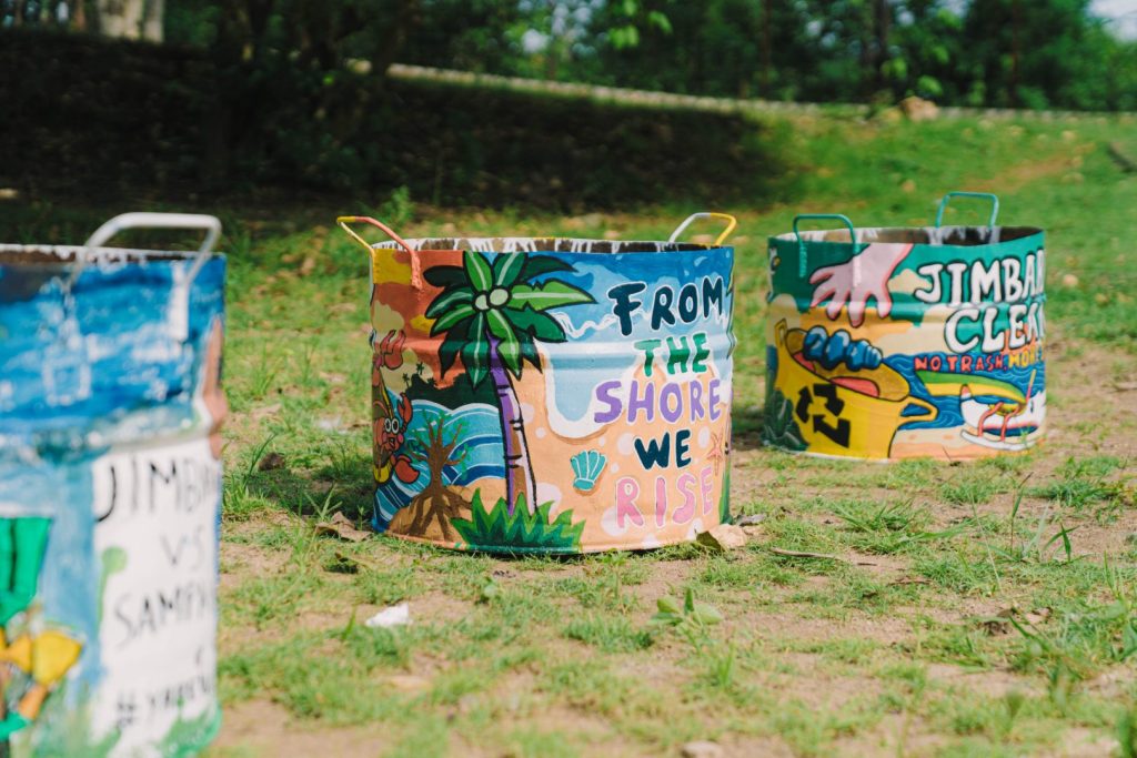Open-air festival atmosphere at Jimbaran Hub surrounded by greenery during JIMBAFEST Bali