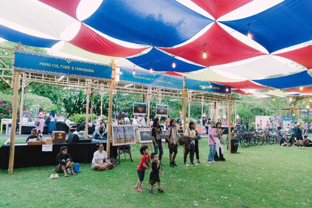 Visitors exploring contemporary Balinese art exhibition at JIMBAFEST showcasing cultural and environmental themes